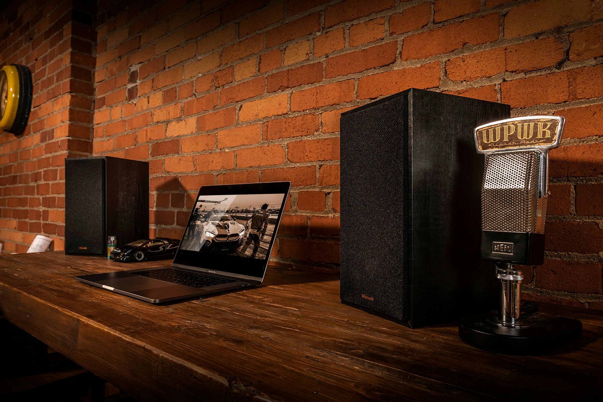 Klipsch Reference Powered Speakers on a desk with a laptop